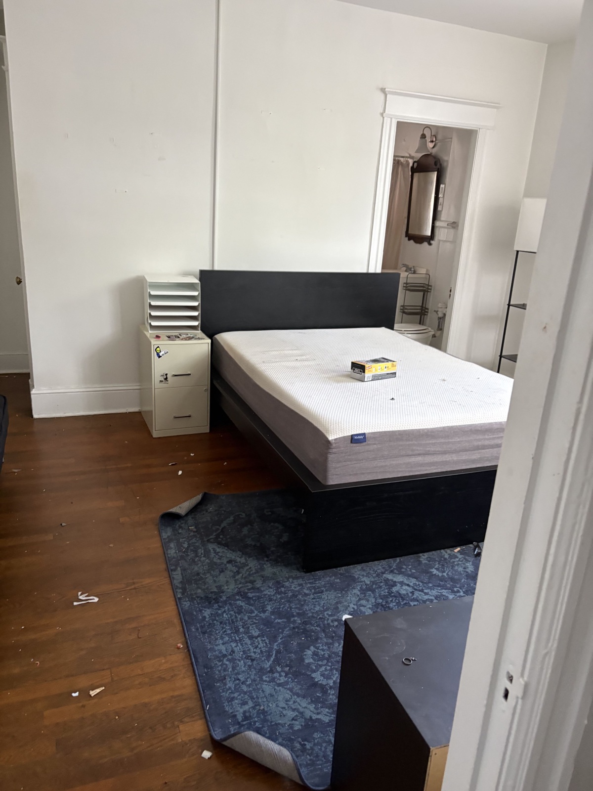 Apartment before the turnover, with furniture and debris left in the room